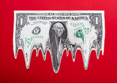 us-1-dollar-bill-in-mid-air-melting-red-gradated-background