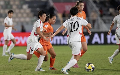 epa12512851-ri-kyong-im-l-and-yu-jong-hyang-r-of-north-korea-in-action-against-kim-rietveld-c-of-the-netherlands-during-the-fifa-u-17-women-s-world-cup-morocco-2025-final-between-north-korea-and-the-netherlands-in-rabat-morocco-08-november-2025-epa-jalal-morchidi