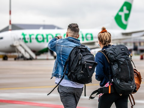 Reizigers op Rotterdam Airport.