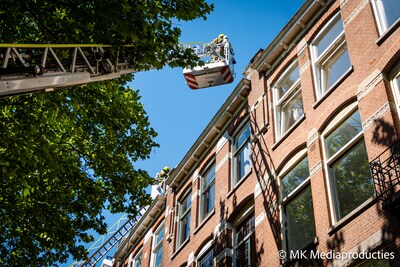 Brand op vierde etage van portiekwoning op Mathenesserlaan in Rotterdam