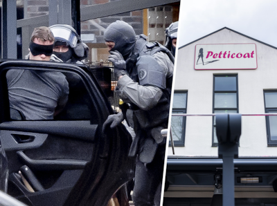 een-man-wordt-gearresteerd-door-de-dsi-voor-een-cafe-in-ede-hierdoor-is-een-einde-gekomen-aan-een-gijzeling-in-het-cafe-waarbij-vier-mensen-werden-vastgehouden-cafe-petticoat-aan-de-nieuwe-stationsstraat-in-ede