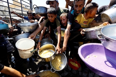 file-photo-palestinians-wait-to-receive-food-from-a-charity-kitchen-after-the-global-hunger-monitor-in-gaza-city-august-28-2025-reuters-mahmoud-issa-file-photo