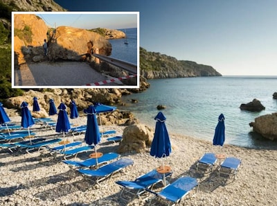 Toeristen uren vast op bekend strand op Rhodos nadat gevallen rotsblok toegangsweg blokkeert