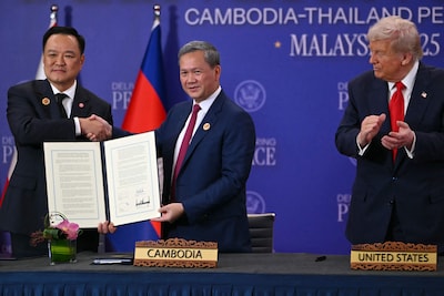 files-us-president-donald-trump-r-looks-on-as-cambodia-s-prime-minister-hun-manet-c-and-thailand-s-prime-minister-anutin-charnvirakul-hold-up-signed-documents-during-a-ceremonial-signing-of-a-ceasefire-agreement-on-the-sidelines-of-the-47th-association-of-southeast-asian-nations-asean-summit-in-kuala-lumpur-on-october-26-2025-half-a-million-evacuees-in-cambodia-and-thailand-were-sheltering-in-pagodas-schools-and-other-safe-havens-on-december-10-2025-after-fleeing-renewed-fighting-in-a-century-old-border-dispute-in-which-us-president-donald-trump-has-vowed-to-again-intercede-photo-by-andrew-caballero-reynolds-afp