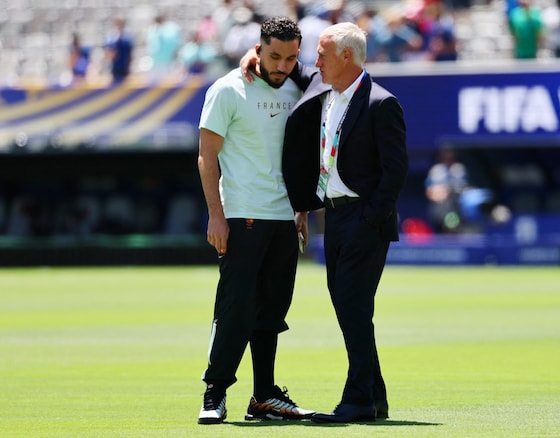 Rayan Cherki and Didier Deschamps.