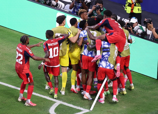 Varela was buried under his teammates. 