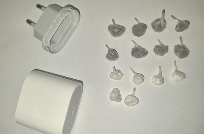 Dealer verstopt bolletjes met cocaïne en heroïne in adapter