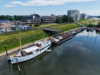 De schippers in de haven zijn bang voor inkijk uit een hoge woontoren: ‘Ik denk dat je heel goeie og